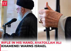 Rifle in his hand, Iran's Supreme Leader Khamenei warns Israel