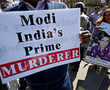 Prime Minister Modi confronted by angry protests in London