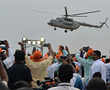 BJP stars heli-hop while Congress netas hit the road