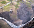 Green grass, black lava at Guatemala golf club