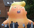 Demonstrators mock Trump with giant balloon