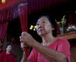 Asia welcomes Lunar New Year with banquets, temple visits