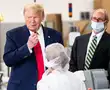 Trump pretends to insert swab, goes maskless at factory