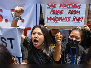 Guwahati: People from Manipur raise slogans during their protest against the ong...