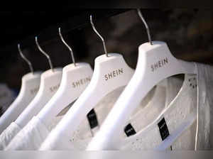 Clothes are displayed on hangers at a Chinese fashion brand Shein pop-up store in Paris on May 4, 2023. The Shein pop-up store is set to open for business from May 5 to 8. (Photo by Christophe ARCHAMBAULT / AFP)
