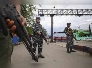 Jammu: Central Reserve Police Force (CRPF) stand guard on Jammu-Pathankot Highwa...