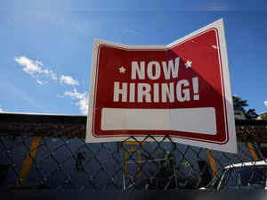 FILE PHOTO: A "now hiring" sign is displayed in Somerville
