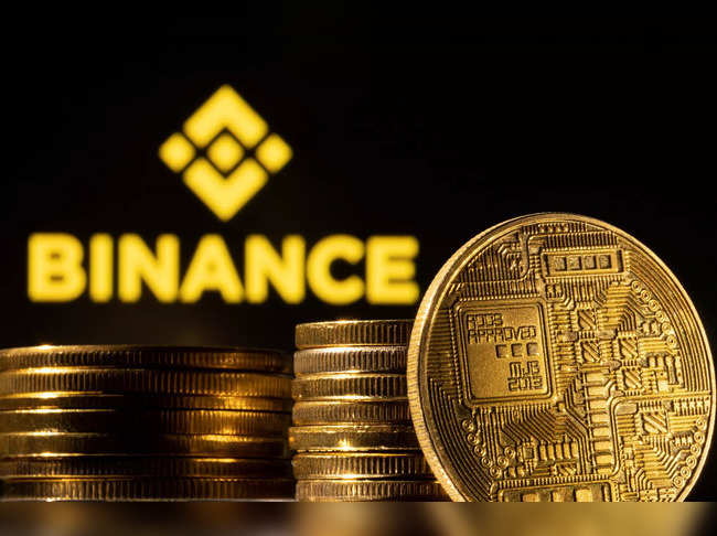 Illustration shows a representation of the cryptocurrency and Binance logo