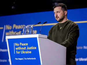 Ukrainian President Volodymyr Zelensky gives a speech at the World Forum in The Hague, on May 4, 2023, as part of his first visit in Netherlands. Ukrainian President Volodymyr Zelensky is visiting The Hague on May 4, 2023 and will meet with the leadership of the International Criminal Court, which has issued an arrest warrant for Russia's Vladimir Putin, his spokesman said. - Netherlands OUT (Photo by Remko de Waal / ANP / AFP)