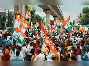 Bengaluru: Congress supporters during a roadshow of Congress leader Priyanka Gan...