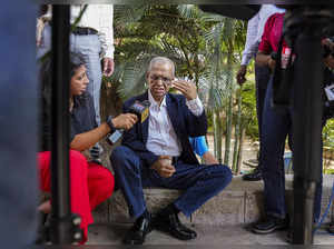 Bengaluru: Infosys founder Narayana Murthy talks to the media after casting his ...
