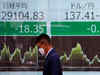 Most Japanese shares fall amid mixed earnings; oil stocks climb
