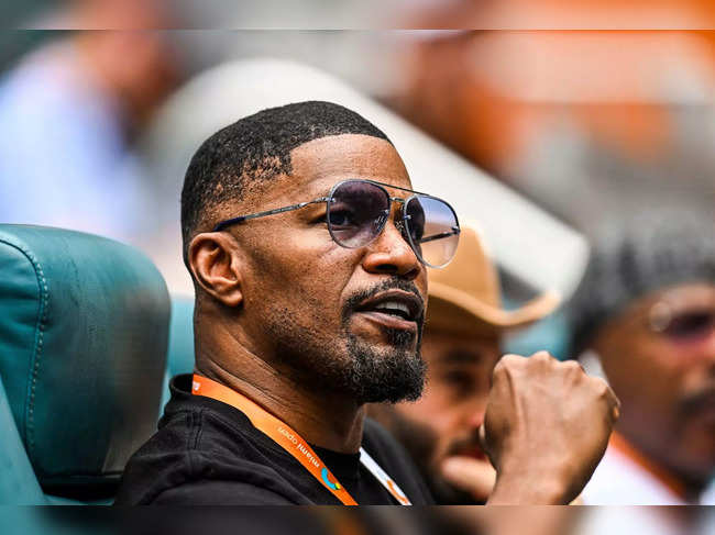 (FILES) In this file photo taken on March 30, 2023 US actor Jamie Foxx attends the men’s quater-final match between Christopher Eubanks of the US and Daniil Medvedev of Russia at the 2023 Miami Open at Hard Rock Stadium in Miami Gardens, Florida.  Oscar-winning US actor Jamie Foxx has been hospitalized with an unspecified medical complication but is in recovery, his family says on April 13, 2023. (Photo by CHANDAN KHANNA / AFP)