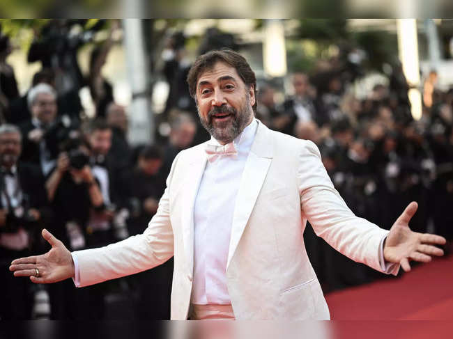 (FILES) In this file photo taken on May 28, 2022 Spanish actor Javier Bardem arrives for the Closing Ceremony of the 75th edition of the Cannes Film Festival in Cannes, southern France. The San Sebastian Festival will fete Javier Bardem with its prestigious Donostia Award in its 71st edition, which will be held from September 22 to 30, as announced by the festival on May 12, 2013 during the presentation of the official poster of the festival that this year will feature an image of Bardem. (Photo by LOIC VENANCE / AFP)