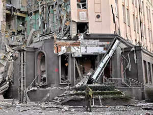 Loud explosions heard in Kyiv, debris causes building fire