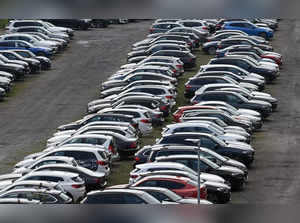 Cars are parked at a parking lot on the grounds of a car dealership in Dortmund, western Germany, on April 18, 2023.   (Photo by Ina FASSBENDER / AFP)
