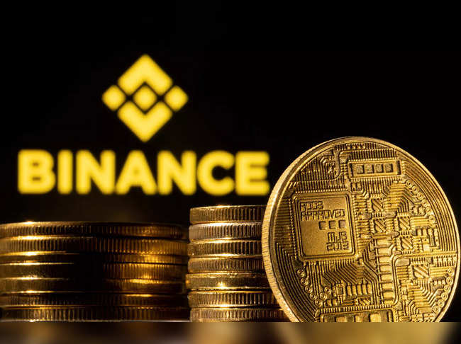 Illustration shows a representation of the cryptocurrency and Binance logo