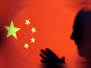 Illustration shows Chinese flag and silhouette of U.S. President Joe Biden