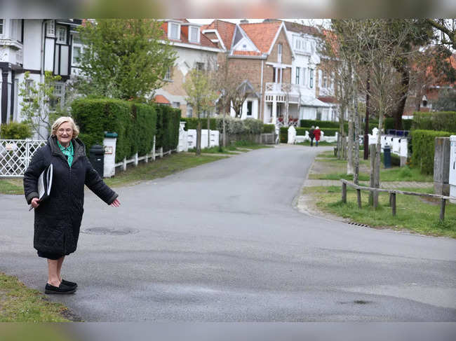 Belgian touristic guide Brigitte Hochs speaks during a tour "on the trail of Albert Einstein" on April 20, 2023 in De Haan, near the villa "Savoyarde" where the famous German scientist lived for six months in 1933 after leaving Germany.   (Photo by Kenzo TRIBOUILLARD / AFP)