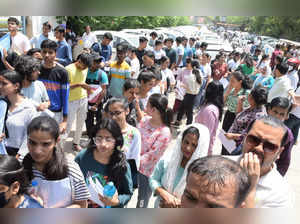 New Delhi: Students wait in a queue to appear in Common University Entrance Test (CUET), outside a centre in New Delhi on Sunday, May 21, 2023. (Photo: IANS/Wasim Sarvar)