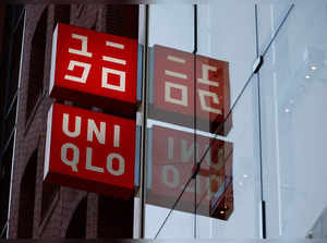 FILE PHOTO: Fast Retailing's Uniqlo sign boards are displayed at a casual clothing store in Tokyo