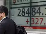 Asian stocks sink on debt ceiling jitters