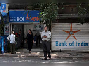 Women leave a Bank of India ATM kiosk in Mumbai