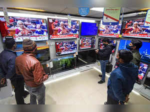 Patna: People watch on television sets, Finance Minister Nirmala Sitharaman pres...