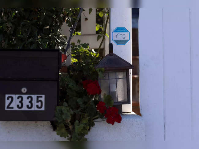 An Amazon Ring sign is shown as a security warning at the entrance to a residential home in Encinitas, California