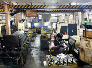 FILE PHOTO: An employee works inside an engineering goods export unit in the manufacturing hub of Faridabad