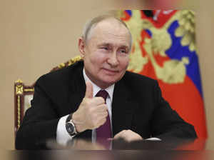 Russian President Vladimir Putin attends a meeting with families awarded Orders ...