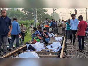 Balasore: Passengers wait at the site where Coromandel Express, Bengaluru-Howrah...