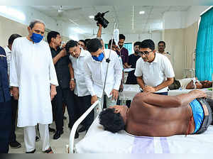 Balasore: Odisha Chief Minister Naveen Patnaik meets an injured at a hospital fo...