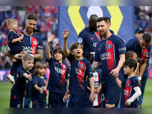 Paris Saint-Germain's Spanish defender Sergio Ramos (L) and Paris Saint-Germain's Argentine forward Lionel Messi attend with their children prior to the French L1 football match between Paris Saint-Germain (PSG) and Clermont Foot 63 at the Parc des Princes Stadium in Paris on June 3, 2023. (Photo by FRANCK FIFE / AFP)