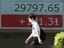 Asian shares extend global rally; oil prices jump on Saudi cuts