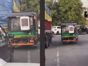 Autorickshaw cooler: Autorickshaw driver fits cooler inside his ...