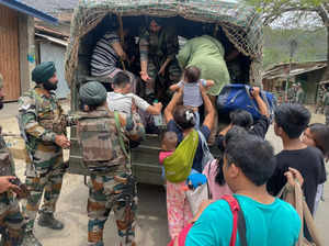 Imphal: Army personnel rescue people from a violence-hit area of Manipur. (PTI P...