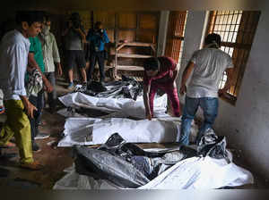 EDITORS NOTE: Graphic content / Bodies are seen at a high school used as temporary mortuary to identify the dead recovered from the carriage wreckage of a three-train collision near Balasore, in India's eastern state of Odisha, on June 4, 2023. At a makeshift morgue in an Indian school, a couple scanned photos of disfigured corpses before leaning in for a closer look at one they think is their 22-year-old son. Authorities were scrambling on June 4 to understand the cause of a three-train collision in India that killed at least 288 people, claiming that "no one responsible" will be
