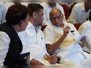 Mumbai: Nationalist Congress Party chief Sharad Pawar with Congress leader Sunil...