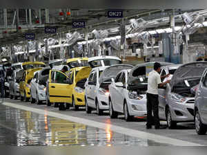 FILE PHOTO: FILE PHOTO: Workers assemble cars inside the Hyundai Motor India Ltd. plant at Kancheepuram district in Tamil Nadu