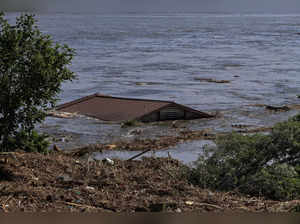 Roof of a house is seen in the Dnipro river which flooded after the Nova Kakhovka dam breached,, in Kherson