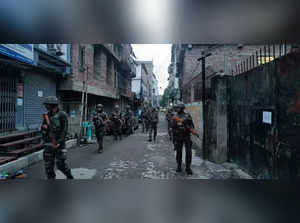 Indian army soldiers patrol during a security operation in hill and valley areas in Manipur.