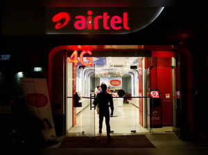 A man leaves a Bharti Airtel store in New Delhi