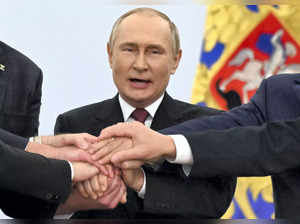 Moscow: Russian President Vladimir Putin joins hands with Moscow-appointed head ...