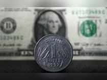 Rupee rises 4 paise to close at 82.47 against US dollar