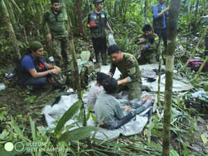 In this handout photo released on June 9, 2023, by the Colombian Presidency, members of the army assist four Indigenous children who were found alive after spending more than a month lost in the Colombian Amazon jungle following the crash of a small plane. Four Indigenous children were found alive Friday after spending more than a month lost in the Colombian Amazon rainforest following a small plane crash that triggered a massive rescue operation, the country's President Gustavo Petro said. - RESTRICTED TO EDITORIAL USE - MANDATORY CREDIT "AFP PHOTO / Colombian Presidency" - NO MARKETING - NO ADVERTISING CAMPAIGNS
