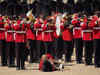British military serviceman faints during parade inspected by Prince William as temperature touches 30 degrees Celsius