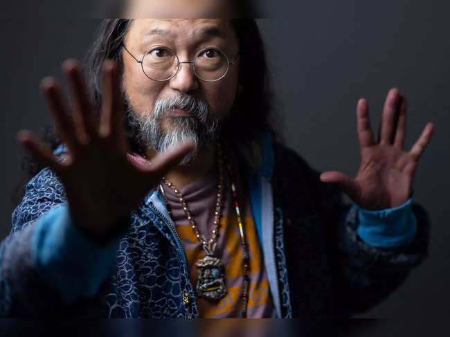 Japanese contemporary artist Takashi Murakami poses during a photo session at the Gagosian Gallery in Le Bourget, outside Paris, on June 8, 2023. (Photo by JOEL SAGET / AFP)