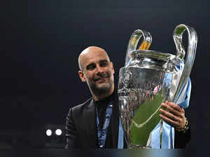 Manchester City's Spanish manager Pep Guardiola poses with the European Cup trophy as they celebrate winning the UEFA Champions League final football match between Inter Milan and Manchester City at the Ataturk Olympic Stadium in Istanbul, on June 10, 2023. Manchester City won the match 1-0. (Photo by Paul ELLIS / AFP)