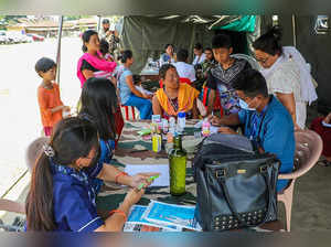 Imphal: People at a medical camp organised by Army, in an area of Manipur. (PTI ...